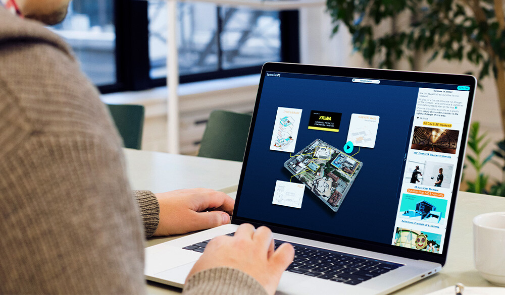 A person with a brown shirt using SpaceDraft on a laptop.