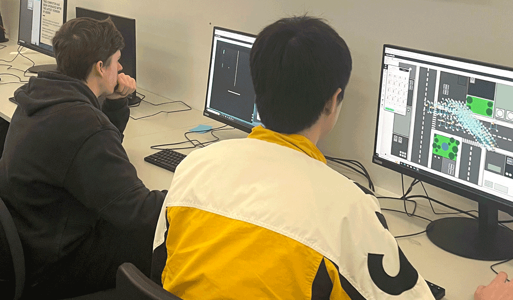 Two students using SpaceDraft in a classroom computer room.
